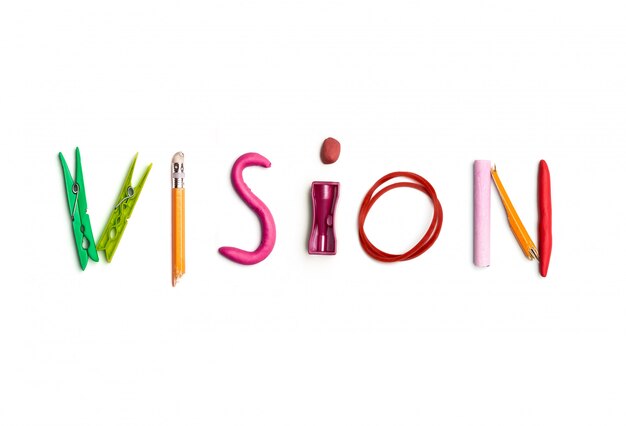 The word vision created from office stationery.