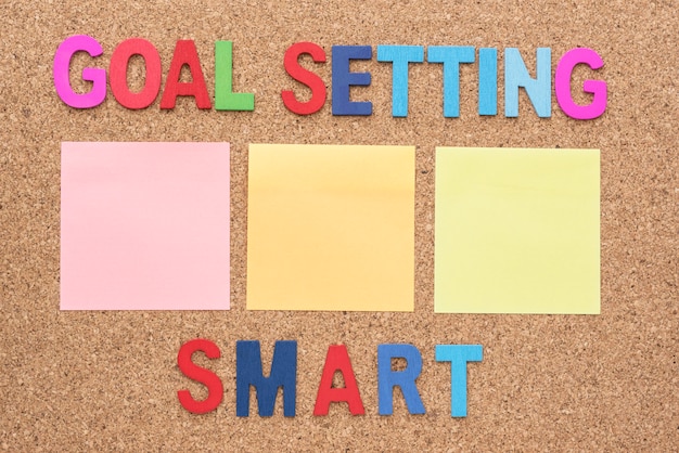 Free photo words goal setting and smart with blank notepad