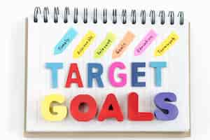 Free photo words goals target on notebook over white background