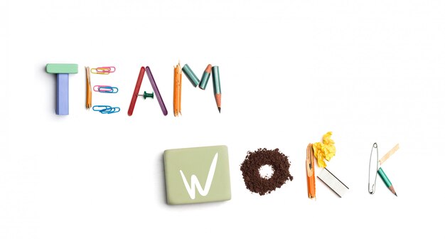 The words team work created from office stationery.