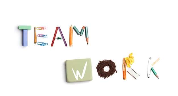 The words team work created from office stationery.