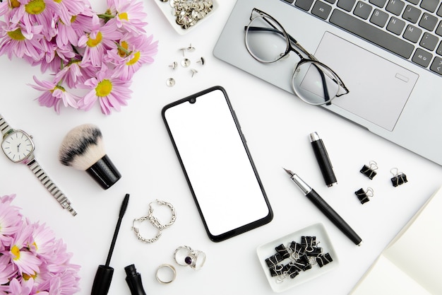 Work composition on white background with different devices and objects