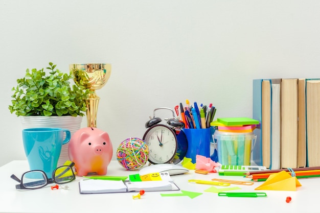 Work place of a creative person with a variety of colorful stationery objects