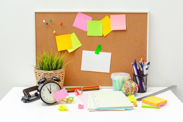 Work place of a creative person with a variety of colorful stationery objects