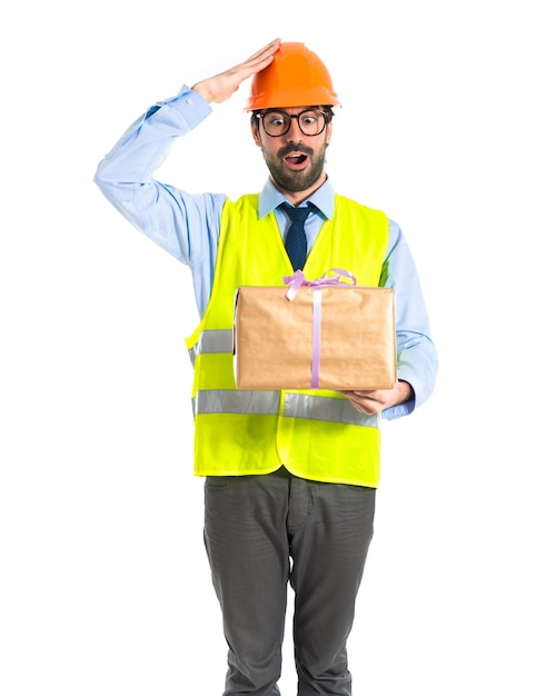 Free photo worker holding a gift