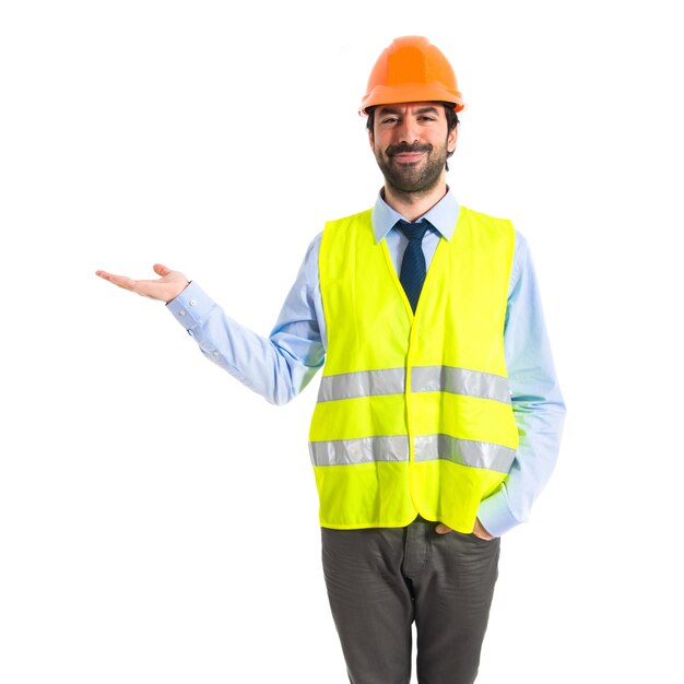 Worker holding something over white background