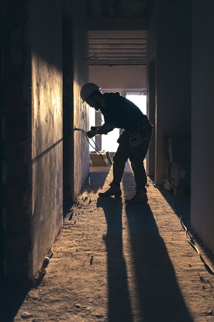 worker is cutting wires with lineman's pliers.