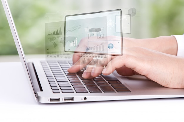 Worker looking at a laptop graphics