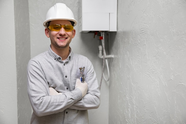 Free photo worker repairing water heater