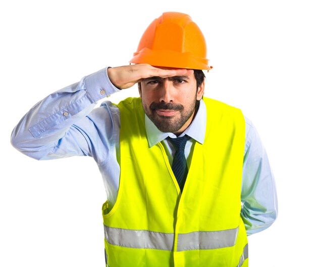 worker showing something over white background