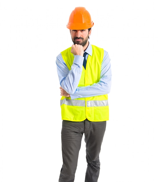 Worker thinking over white background