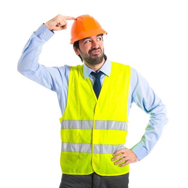 Worker thinking over white background