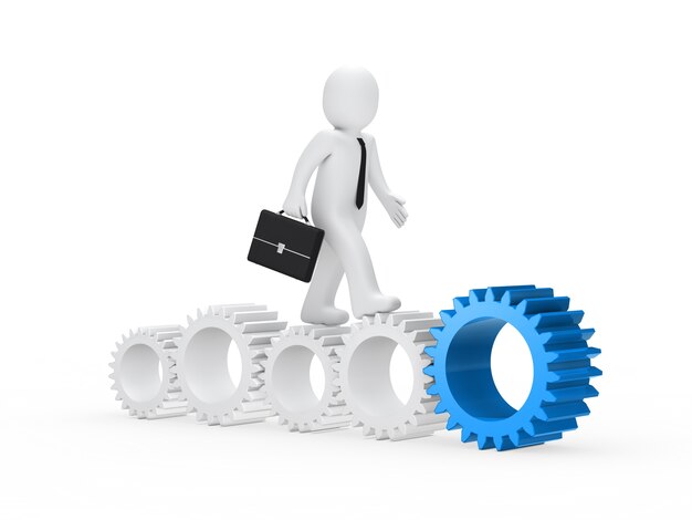 Worker walking along gears of different sizes