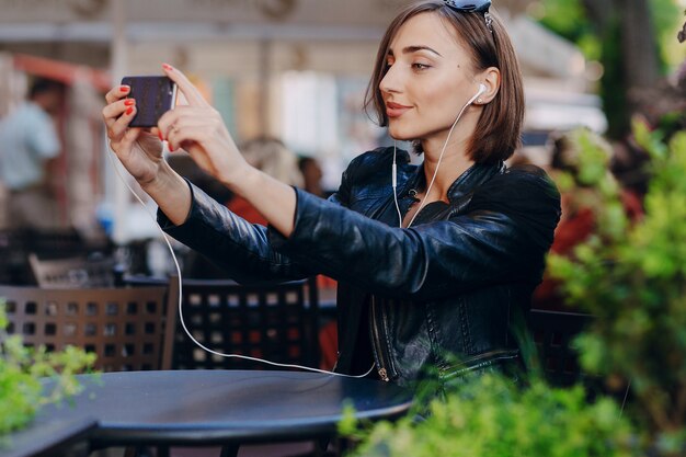 Worker with leather jacket taking a photo