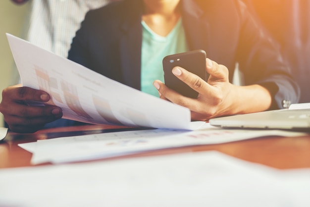 Worker with phone and papers