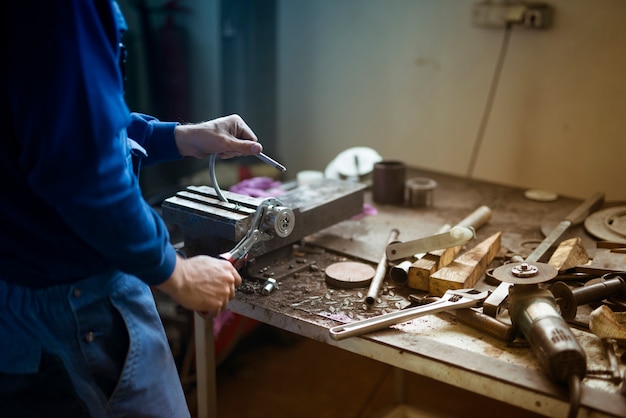 Worker working in metal workshop