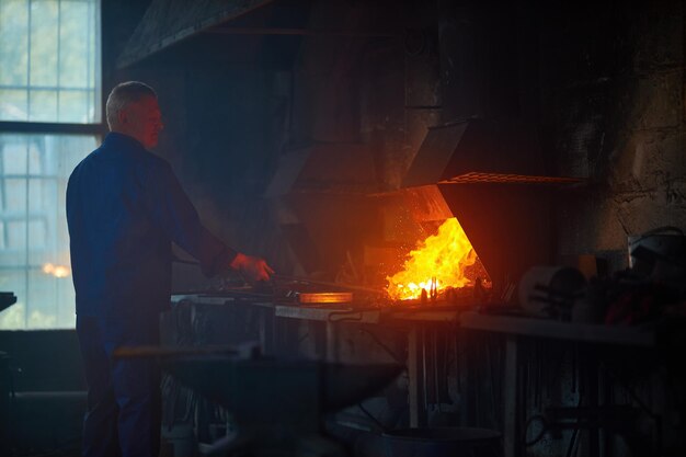 Worker working near special heating equipment