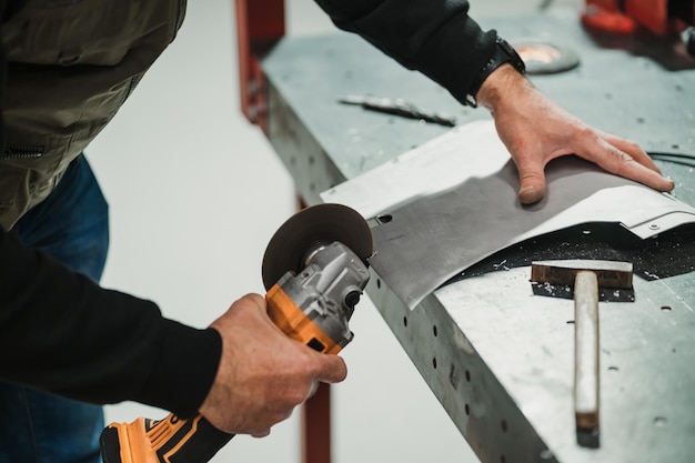 Worker working with a circular grinder