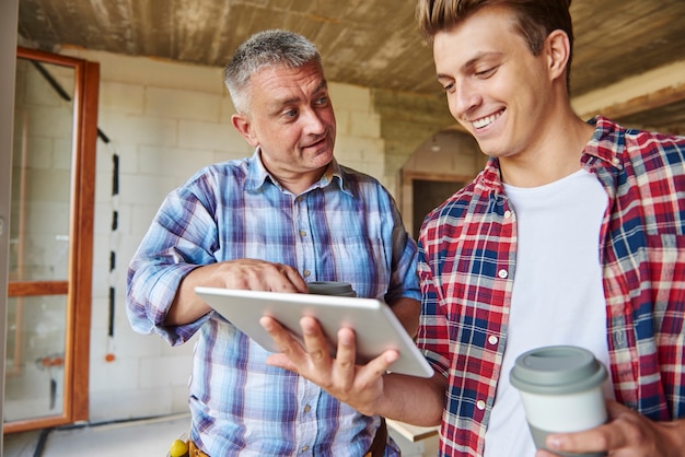 Workers having a little chat while having cup of coffee