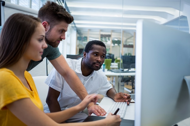 Workers looking at a screen