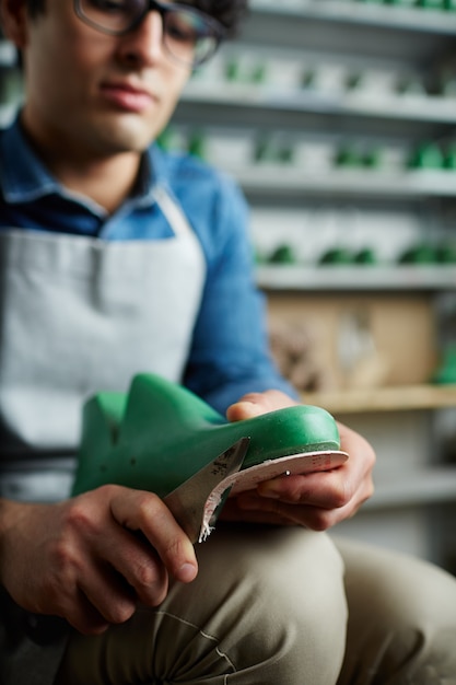 Free Photo | Working cobbler