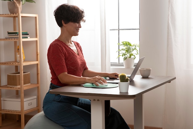 Free photo working from home in ergonomic workstation