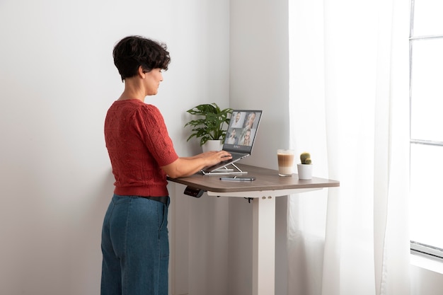 Free photo working from home in ergonomic workstation