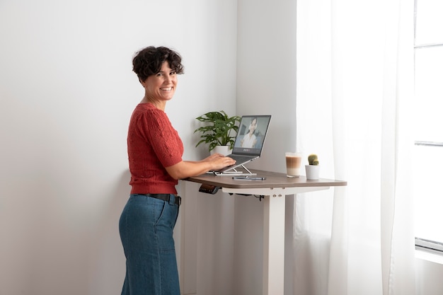 Free photo working from home in ergonomic workstation