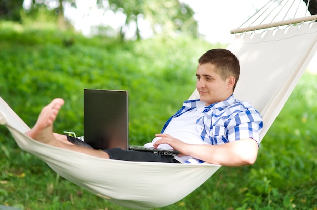 Working on hammock with laptop