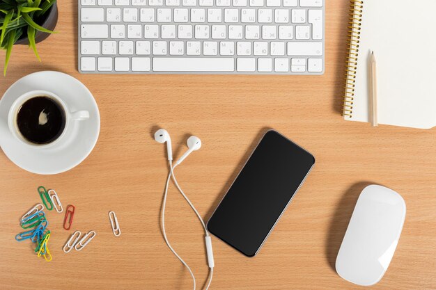 Working place at wooden desktop with coffee