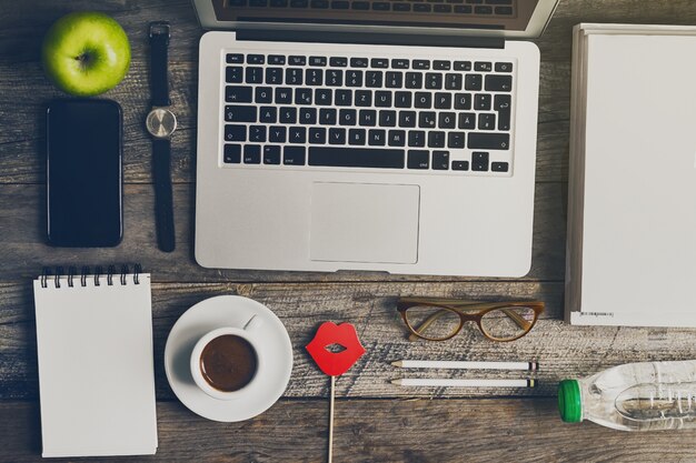 Free photo working space business freelance concept top view above flat lay with hands working on laptop. toning. flat lay.