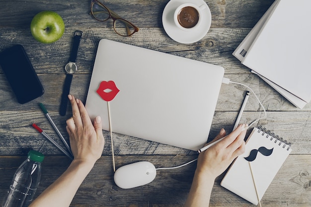 Working Space Business Freelance Concept Top View Above Flat Lay with Hands Working on Laptop. Toning. 