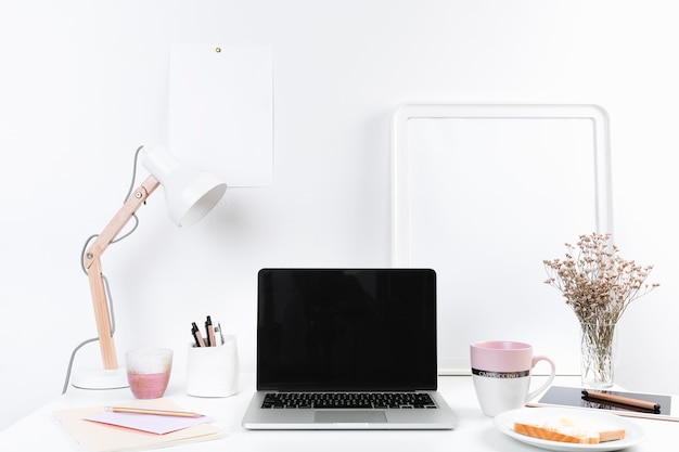 Working table with laptop and snacks