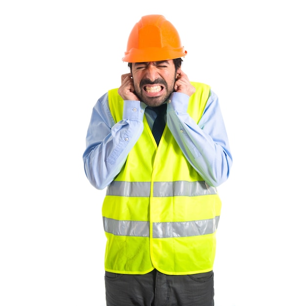 Free photo workman covering his ears