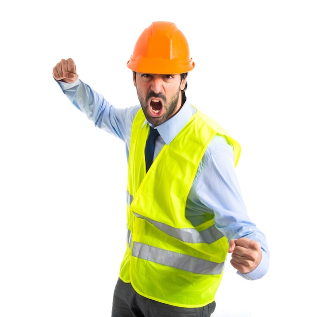 Workman giving punch over white background