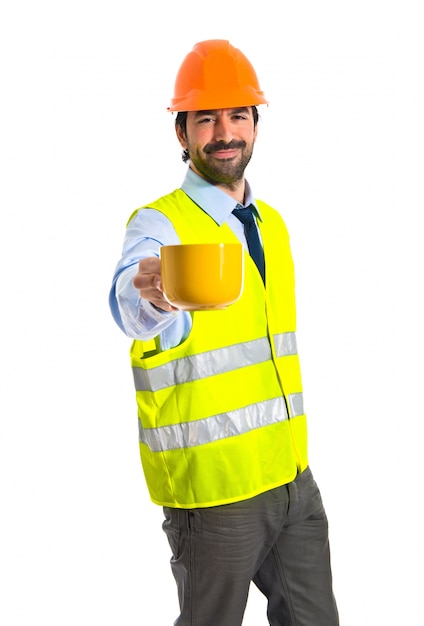 Workman holding a cup of coffee
