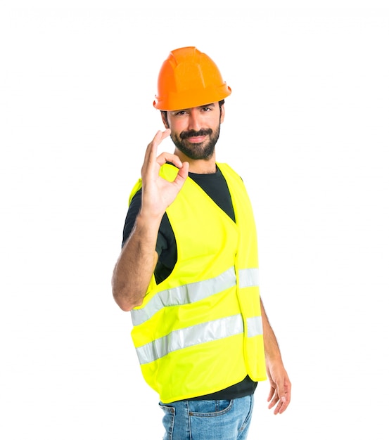 Workman making Ok sign over white background