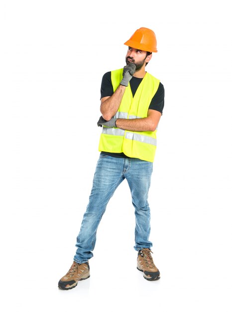 Workman thinking over isolated white background