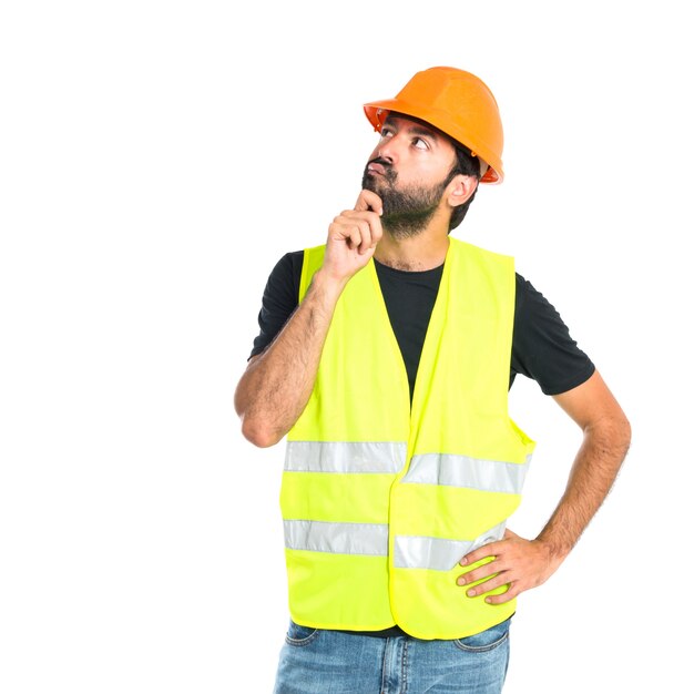 Workman thinking over isolated white background