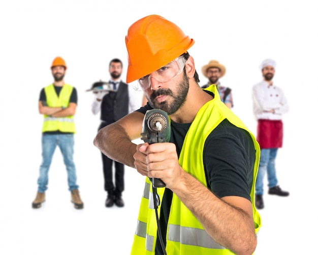 workman with drill over white background