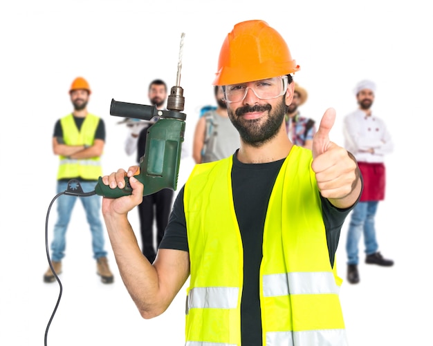workman with drill over white background