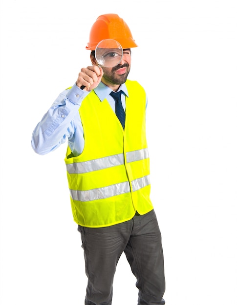 Free photo workman with magnifying glass