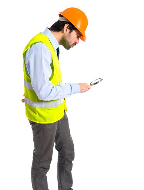 Workman with magnifying glass