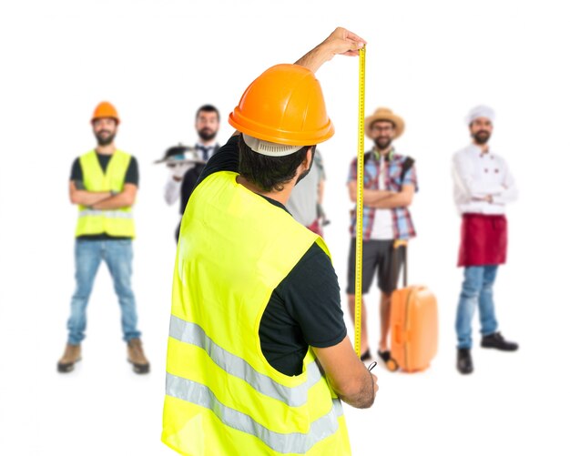 Workman with meter over white background