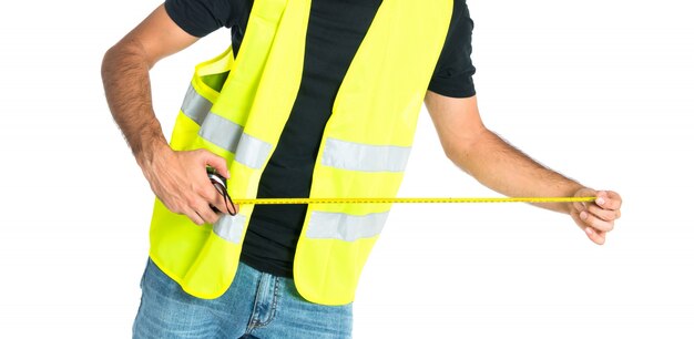 Workman with meter over white background