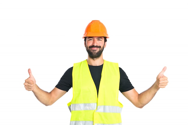 Workman with thumb up over white background