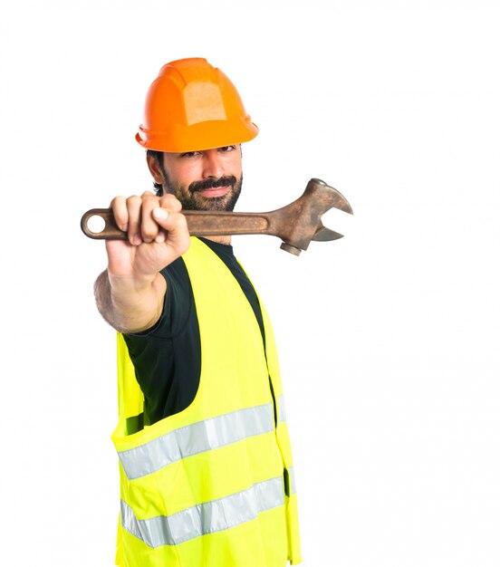 workman with wrench over white background