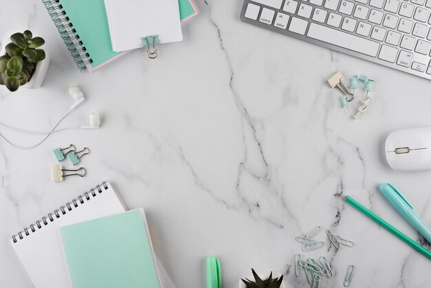 Workplace items on marble table top view