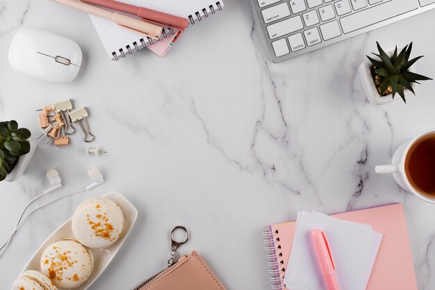 Workplace items on marble table above view