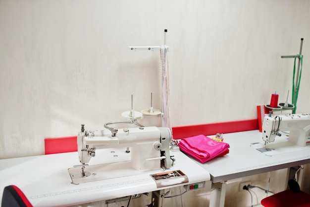 Workplace of seamstress office with sewing machine on table